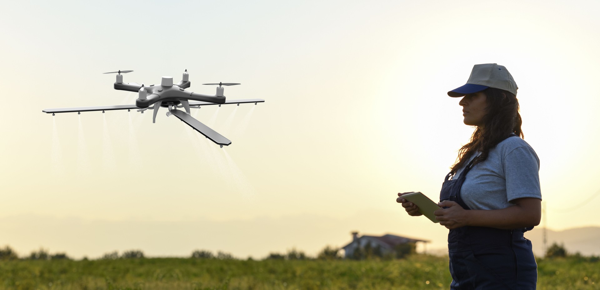 Young female farmer operating smart-farming drone